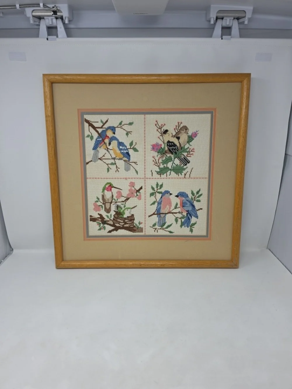 Framed Four-Panel Bird Cross-Stitch Wall Art in Blue, Pink & Green